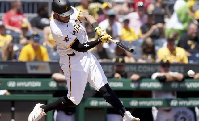 Pittsburgh Pirates' Tommy Pham hits an RBI single during the seventh inning of a baseball game against the St. Louis Cardinals, Wednesday, July 2, 2025, in Pittsburgh. (AP Photo/Matt Freed)