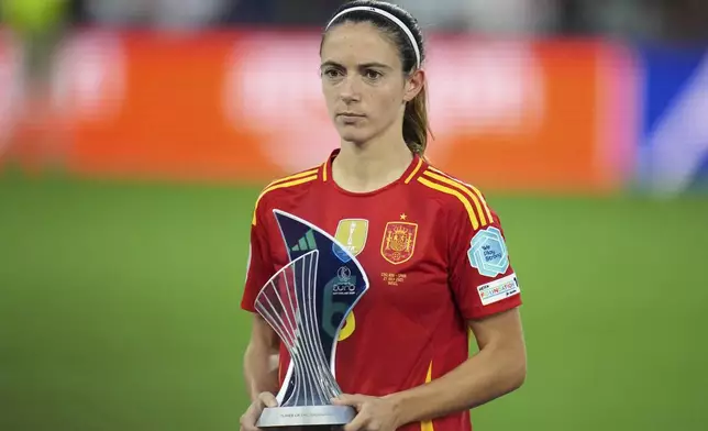 Spain's Aitana Bonmati poses with the "Best Player" of the tournament award at the end of the Women's Euro 2025 final soccer match between England and Spain at St. Jakob-Park in Basel, Switzerland, Sunday, July 27, 2025. (AP Photo/Alessandra Tarantino)