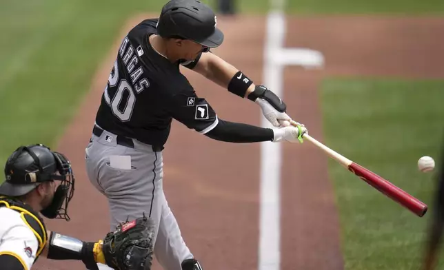 Chicago White Sox's Miguel Vargas (20) hits a three-run home run off Pittsburgh Pirates pitcher Andrew Heaney during the first inning of a baseball game in Pittsburgh, Sunday, July 20, 2025. (AP Photo/Gene J. Puskar)