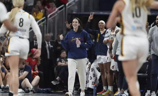 Indiana Fever's Caitlin Clark reacts during the first half in a WNBA basketball game against the Los Angeles Sparks, Thursday, June 26, 2025, in Indianapolis. (AP Photo/Michael Conroy)