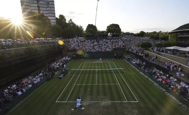 General view as Gael Monfils of France plays a return to Marton Fucsovics of Hungary in their second round men's singles match at the Wimbledon Tennis Championships in London, Thursday, July 3, 2025.(AP Photo/Kirsty Wigglesworth)