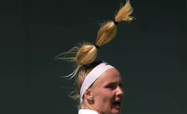 Rebecca Srampova of Slovakia watches the ball during her first round women's single match against Beatriz Haddad Maia of Brazil at the Wimbledon Tennis Championships in London, Monday, June 30, 2025. (AP Photo/Kirsty Wigglesworth)