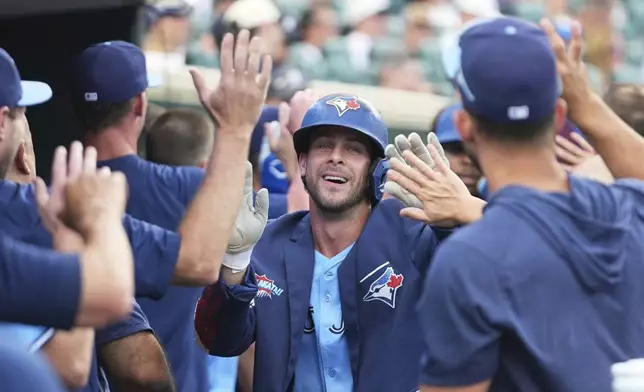 Toronto Blue Jays' Ernie Clement celebrates his three-run home run against the Detroit Tigers during the sixth inning of a baseball game Thursday, July 24, 2025, in Detroit. (AP Photo/Paul Sancya)