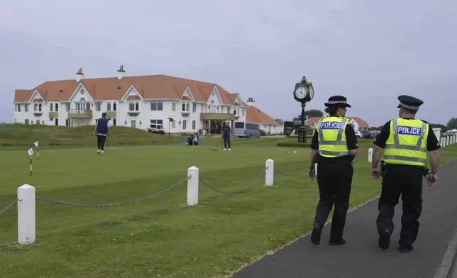 Police patrol near the Trump Turnberry golf course in Turnberry, Scotland, Wednesday, July 23, 2025, President Trump is expected to visit Scotland in the next few day. (AP Photo/Alastair Grant)
