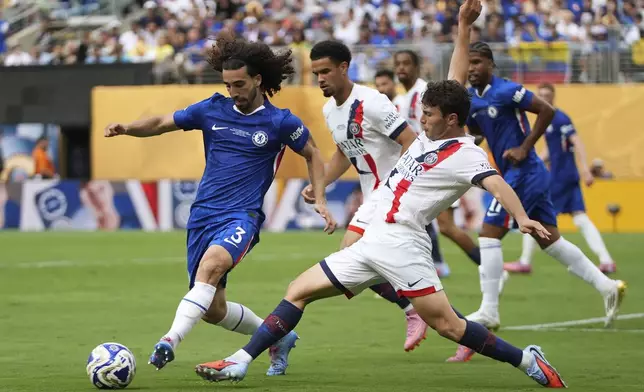 Chelsea's Marc Cucurella and Paris Saint-Germain's Joao Neves vie for control of the ball during the second half of the Club World Cup final soccer match in East Rutherford, N.J., Sunday, July 13, 2025. (AP Photo/Frank Franklin II)