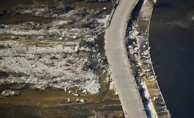 This aerial photo shows damage from flash floods along the Guadalupe River in Kerr County, Texas, Thursday, July 10, 2025. (AP Photo/Gerald Herbert)