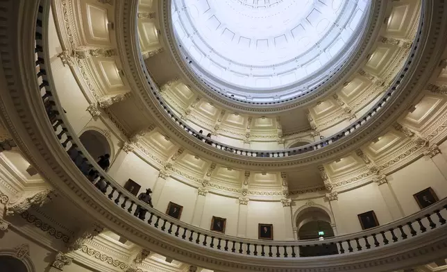 A state trooper keeps watch over the Rotunda at the Texas Capitol as the House calls a Special Session, Monday, July 21, 2025, in Austin. (AP Photo/Eric Gay)