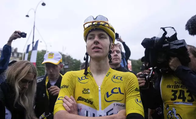 Tour de France winner Tadej Pogacar of Slovenia reacts after the twenty-first stage of the Tour de France cycling race over 132.3 kilometers (82.1 miles) with start in Mantes-la-Ville and finish on the Champs-Elysees in Paris, France, Sunday, July 27, 2025. (AP Photo/Mosa'ab Elshamy)