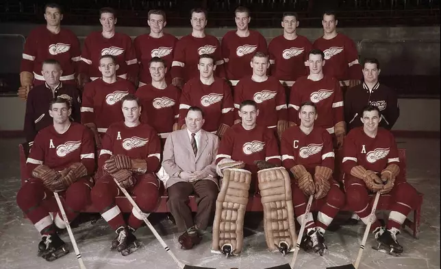 FILE - The Detroit Red Wings team poses for a photo in 1955. From left, front row: Bob Goldham, Len Kelly, head coach James Skinner, Terry Sawchuk, Ted Lindsay, and Marty Pavelich. Second row: trainer Carl Mattson, Earl Reibel, Tony Leswick, Marcel Bonin, John Wilson, Bill Dineen, and assistant trainer Lefty Wilson. Back row: Vic Stasiuk, Marcel Pronovost, Jim Hay, Benny Woit, Glen Skov, Alex Delvecchio, and Gordie Howe. (Detroit News via AP, File)