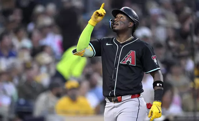 Arizona Diamondbacks' Geraldo Perdomo celebrates while rounding the bases after hitting a grand slam home run during the fifth inning of a baseball game against the San Diego Padres, Wednesday, July 9, 2025, in San Diego. (AP Photo/Orlando Ramirez)