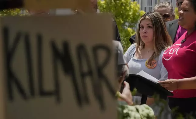 Jennifer Vasquez Sura, wife of Kilmar Abrego Garcia, second right, attends a news conference outside the federal courthouse Wednesday, July 16, 2025, in Nashville, Tenn. (AP Photo/George Walker IV)