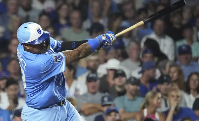 Kansas City Royals' Salvador Perez hits a two-run home run during the eighth inning of a baseball game against the Chicago Cubs in Chicago, Monday, July 21, 2025. (AP Photo/Nam Y. Huh)