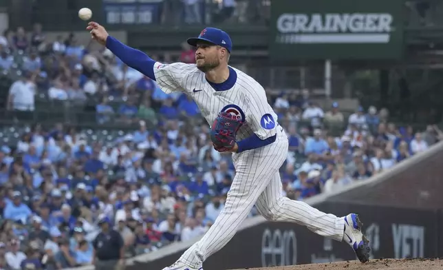 Chicago Cubs starting pitcher Ryan Brasier throws against the Kansas City Royals during the first inning of a baseball game in Chicago, Monday, July 21, 2025. (AP Photo/Nam Y. Huh)