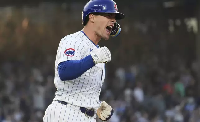 Chicago Cubs' Matt Shaw celebrates as he rounds the bases after hitting a three-run home run during the second inning of a baseball game against the Kansas City Royals in Chicago, Monday, July 21, 2025. (AP Photo/Nam Y. Huh)