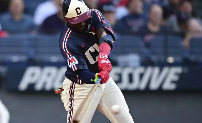 Cleveland Guardians' Johnathan Rodríguez hits an RBI single during the third inning of a baseball game against the Athletics, Friday, July 18, 2025, in Cleveland. Brayan Rocchio scored on the play. (AP Photo/David Dermer)