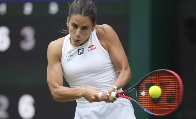 Emma Navarro of the U.S. returns to Barbora Krejcikova of Czech Republic during their women's singles third round match at the Wimbledon Tennis Championships in London, Saturday, July 5, 2025.(AP Photo/Alastair Grant)