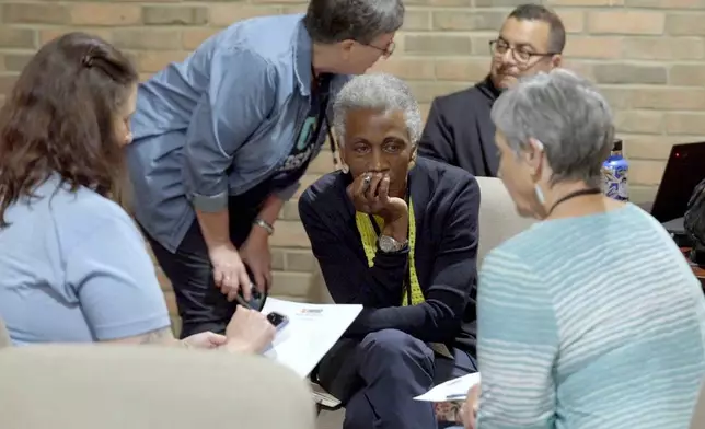 In this image taken from video, participants hold a discussion in a breakout session during a training hosted by Undivided at Central Christian Church in Springfield, Ohio, aimed at teaching community and church leaders how to support and shelter immigrants facing deportation, Tuesday, July 29, 2025. (AP Photo/Obed Lamy)