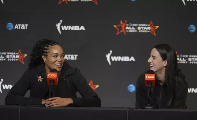 Minnesota Lynx's Napheesa Collier, left, and Indiana Fever's Caitlin Clark, right, speak during a news conference before the WNBA All-Star basketball game Saturday, July 19, 2025, in Indianapolis. (AP Photo/Michael Conroy)
