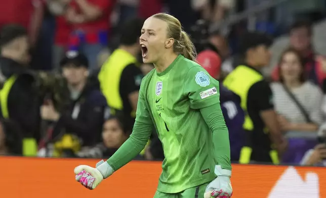 England goalkeeper Hannah Hampton reacts after a save during a penalty shootout at the end of the Women's Euro 2025 final soccer match between England and Spain at St. Jakob-Park in Basel, Switzerland, Sunday, July 27, 2025. (AP Photo/Alessandra Tarantino)