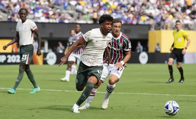 Chelsea's Andrey Santos (17), left, and Fluminense's Agustin Canobbio (17) battle for the ball during the Club World Cup semifinal soccer match between Fluminense and Chelsea in East Rutherford, N.J., Tuesday, July 8, 2025. (AP Photo/Seth Wenig)
