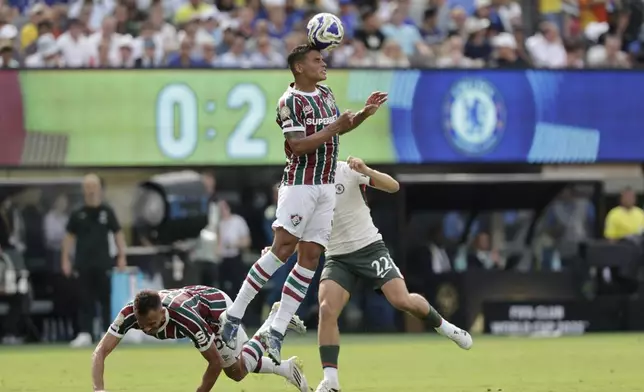 Fluminense's Thiago Silva heads the ball during the Club World Cup semifinal soccer match between Fluminense and Chelsea in East Rutherford, N.J., Tuesday, July 8, 2025. (AP Photo/Adam Hunger)