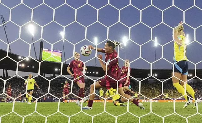 Germany's Carlotta Wamser stops a goal with her arm seeing a red card and giving away a penalty during the Women's Euro 2025, group C, soccer match between Sweden and Germany at Stadion Letzigrund in Zurich, Switzerland, Saturday, July 12, 2025. (AP Photo/Martin Meissner)
