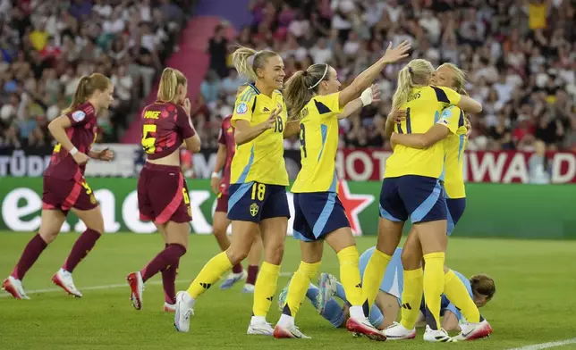 Sweden's Smilla Holmberg, right, celebrates after scoring her side's second goal during the Women's Euro 2025, group C, soccer match between Sweden and Germany at Stadion Letzigrund in Zurich, Switzerland, Saturday, July 12, 2025. (AP Photo/Martin Meissner)