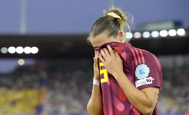 Germany's Carlotta Wamser reacts after seeing a red card for stopping a goal with her arm during the Women's Euro 2025, group C, soccer match between Sweden and Germany at Stadion Letzigrund in Zurich, Switzerland, Saturday, July 12, 2025. (AP Photo/Martin Meissner)