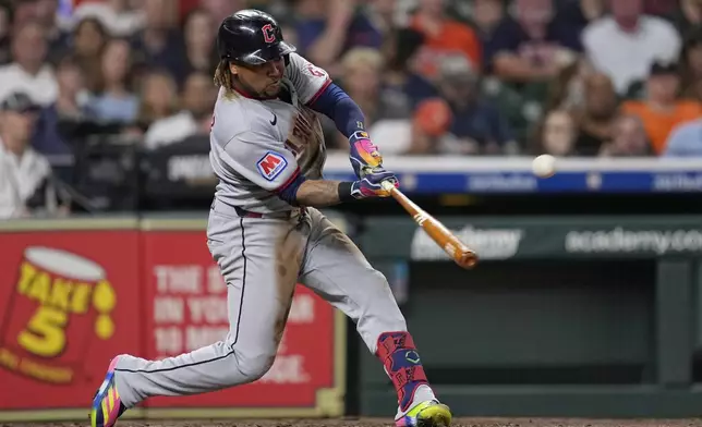 Cleveland Guardians' José Ramírez hits a three-run home run against the Houston Astros during the fifth inning of a baseball game Monday, July 7, 2025, in Houston. (AP Photo/David J. Phillip)