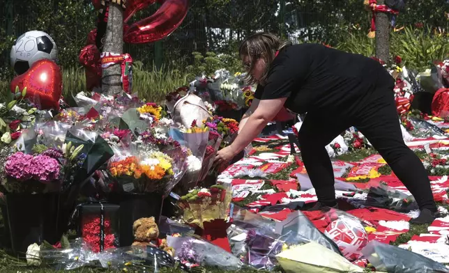 Football fans leave tributes in memory of Liverpool player Diogo Jota at Anfield Stadium, home of FC Liverpool in Liverpool, Thursday, July 3, 2025.(AP Photo/Ian Hodgson)