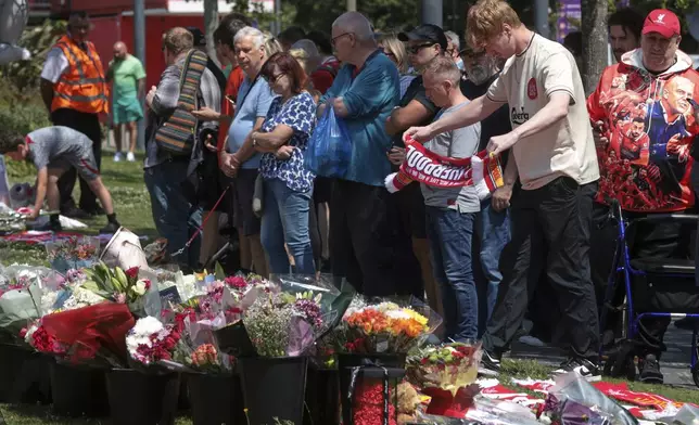 Football fans leave tributes in memory of Liverpool player Diogo Jota at Anfield Stadium, home of Liverpool FC in Liverpool, Thursday, July 3, 2025.(AP Photo/Ian Hodgson)