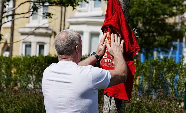Tributes are left at Anfield Stadium, home of Liverpool, in memory of Liverpool player Diogo Jota, Thursday July 3, 2025. (Peter Byrne/PA via AP)