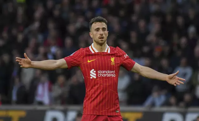 FILE - Liverpool's Diogo Jota gestures during the English Premier League soccer match between Wolverhampton Wanderers and Liverpool at the Molineux Stadium in Wolverhampton, England, Saturday, Sept. 28, 2024. (AP Photo/Rui Vieira, File)