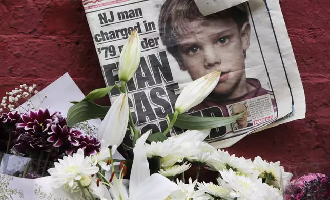 FILE - A newspaper with a photograph of Etan Patz is seen on May 28, 2012, at a makeshift memorial in the SoHo neighborhood of New York, where Patz lived before his disappearance on May 25, 1979. (AP Photo/Mark Lennihan, File)