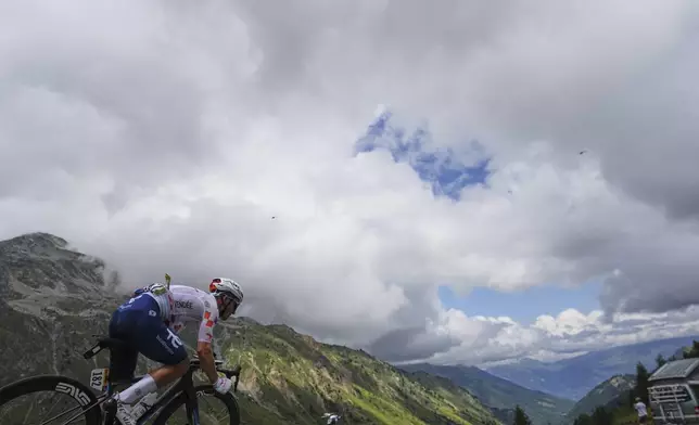 France's Mathieu Burgaudeau speeds down Col du Glandon during the eighteenth stage of the Tour de France cycling race over 171.5 kilometers (106.6 miles) with start in Vif and finish in Courchevel Col de la Loze, France, Thursday, July 24, 2025. (AP Photo/Thibault Camus)