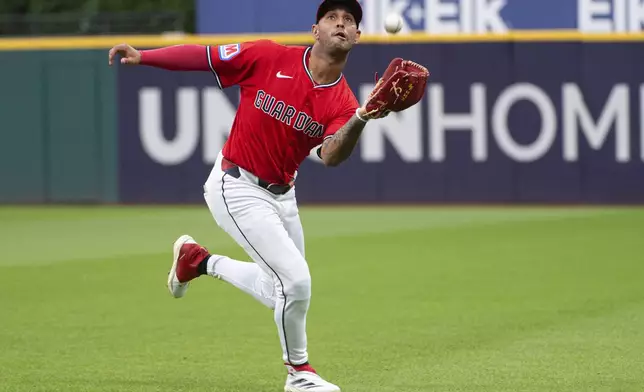 Cleveland Guardians' Brayan Rocchio catches a pop fly by Colorado Rockies' Austin Nola during the sixth inning of a baseball game, Wednesday, July 30, 2025, in Cleveland. (AP Photo/Phil Long)