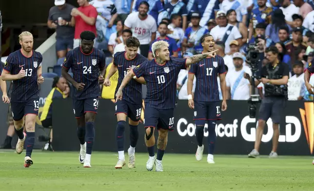 United States midfielder Diego Luna (10) celebrates after scoring a goal during the first half of a CONCACAF Gold Cup semifinal soccer match against Guatemala, Wednesday, July 2, 2025, in St. Louis. (AP Photo/Scott Kane)