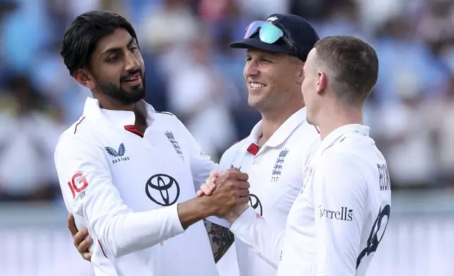 England's Shoaib Bashir, left, celebrate with teammates after their win against India on the fifth and final day of the third cricket test match between England and India at Lord¥s cricket ground in London, Monday, July 14, 2025. (AP Photo/Richard Pelham)