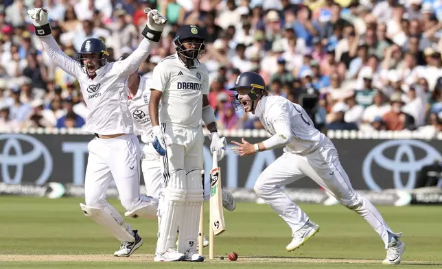 England's players celebrate their win against India on the fifth and final day of the third cricket test match between England and India at Lord's cricket ground in London, Monday, July 14, 2025. (AP Photo/Richard Pelham)