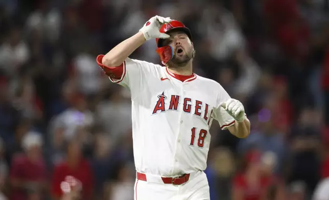 Los Angeles Angels Nolan Schanuel reacts after hitting a flyout with the bases loaded during the ninth inning of a baseball against the Seattle Mariners game Thursday, July 24, 2025, in Anaheim, Calif. (AP Photo/William Liang)