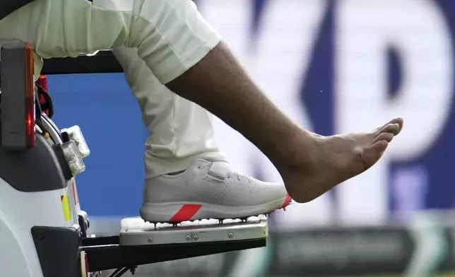 India's Rishabh Pant driven off the field after getting hurt during the fourth cricket test match between England and India at Emirates Old Trafford, Manchester, England, Wednesday, July 23, 2025.(AP Photo/Jon Super)