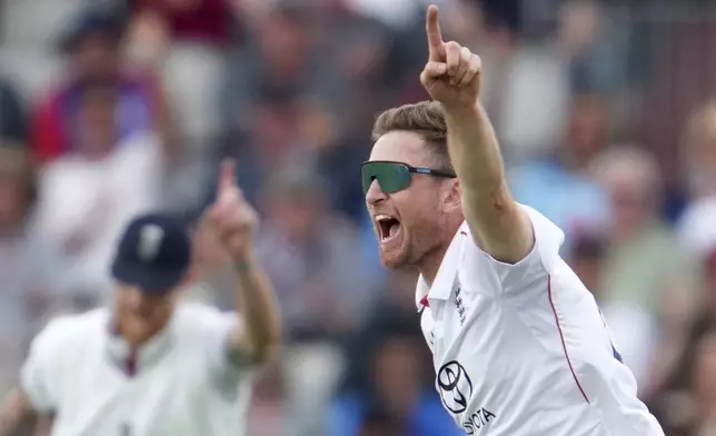 England's Liam Dawson celebrates the dismissal of India's Yashasvi Jaiswal during the fourth cricket test match between England and India at Emirates Old Trafford, Manchester, England, Wednesday, July 23, 2025.(AP Photo/Jon Super)