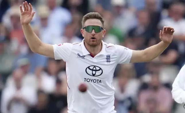 England's Liam Dawson look at the ball during the fourth cricket test match between England and India at Emirates Old Trafford, Manchester, England, Wednesday, July 23, 2025.(AP Photo/Jon Super)