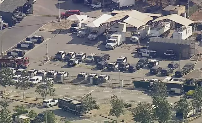 Police and emergency vehicles are in place at the scene of a blast at the Biscailuz Center Training Academy in East Los Angeles on Friday, July 18, 2025. (KABC-TV via AP)