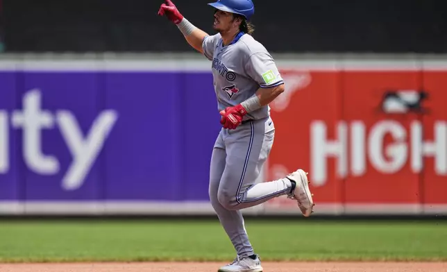 Toronto Blue Jays' Addison Barger rounds the bases after hitting a two-run home run during the fourth inning in the first baseball game of a doubleheader against the Baltimore Orioles, Tuesday, July 29, 2025, in Baltimore. (AP Photo/Stephanie Scarbrough)
