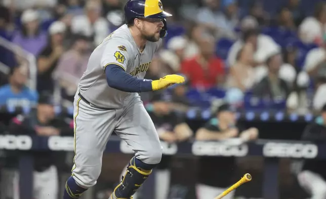Milwaukee Brewers' Rhys Hoskins runs after hitting a RBI triple to score Jackson Chourio during the second inning of a baseball game against the Miami Marlins, Saturday, July 5, 2025, in Miami. (AP Photo/Lynne Sladky)