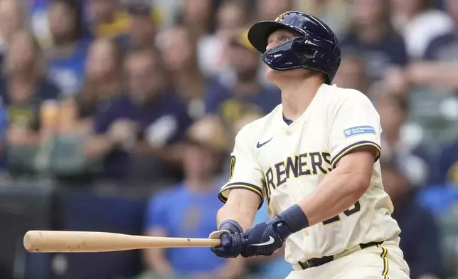 Milwaukee Brewers' Andrew Vaughn hits a three-run home run during the first inning of a baseball game against the Los Angeles Dodgers, Monday, July 7, 2025, in Milwaukee. (AP Photo/Aaron Gash)