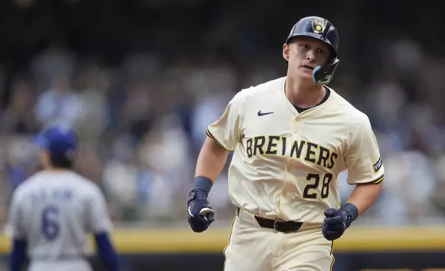 Milwaukee Brewers' Andrew Vaughn rounds the bases after hitting a three-run home run during the first inning of a baseball game against the Los Angeles Dodgers, Monday, July 7, 2025, in Milwaukee. (AP Photo/Aaron Gash)