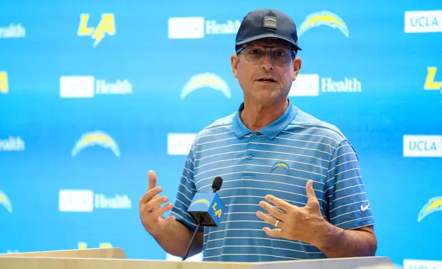 Los Angeles Chargers head coach Jim Harbaugh speaks during a press conference during training camp for the NFL football team Thursday, July 17, 2025, in El Segundo, Calif. (AP Photo/Eric Thayer)