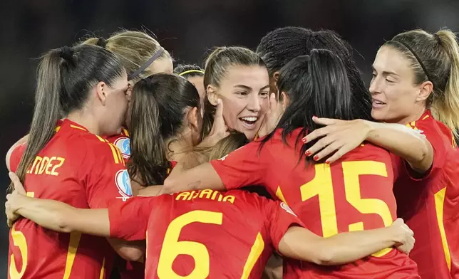 Spain's Patri Guijarro, center, celebrates after scoring her side's second goal during the Women's Euro 2025, group B, soccer match between Italy and Spain at Stadion Wankdorf in Bern, Switzerland, Friday, July 11, 2025. (AP Photo/Martin Meissner)